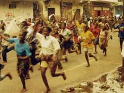 Liberian citizens march doing the civil war